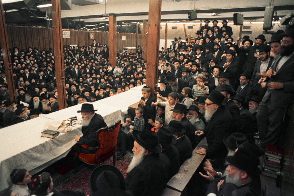 The Rebbe addressing a farbrengen at 770 Eastern Parkway. During my childhood, farbrengens with the Rebbe were a regular part of life, often taking place weekly.